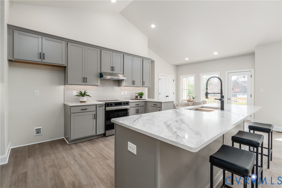 2301 Larkwood Road Henrico, VA 23294 - Photo 11 of 44 a kitchen with sink a stove and cabinets