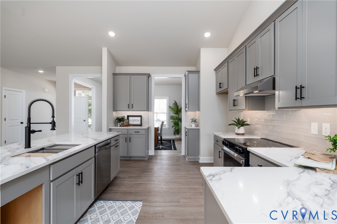 2301 Larkwood Road Henrico, VA 23294 - Photo 14 of 44 a large kitchen with stainless steel appliances lots of counter space and a sink