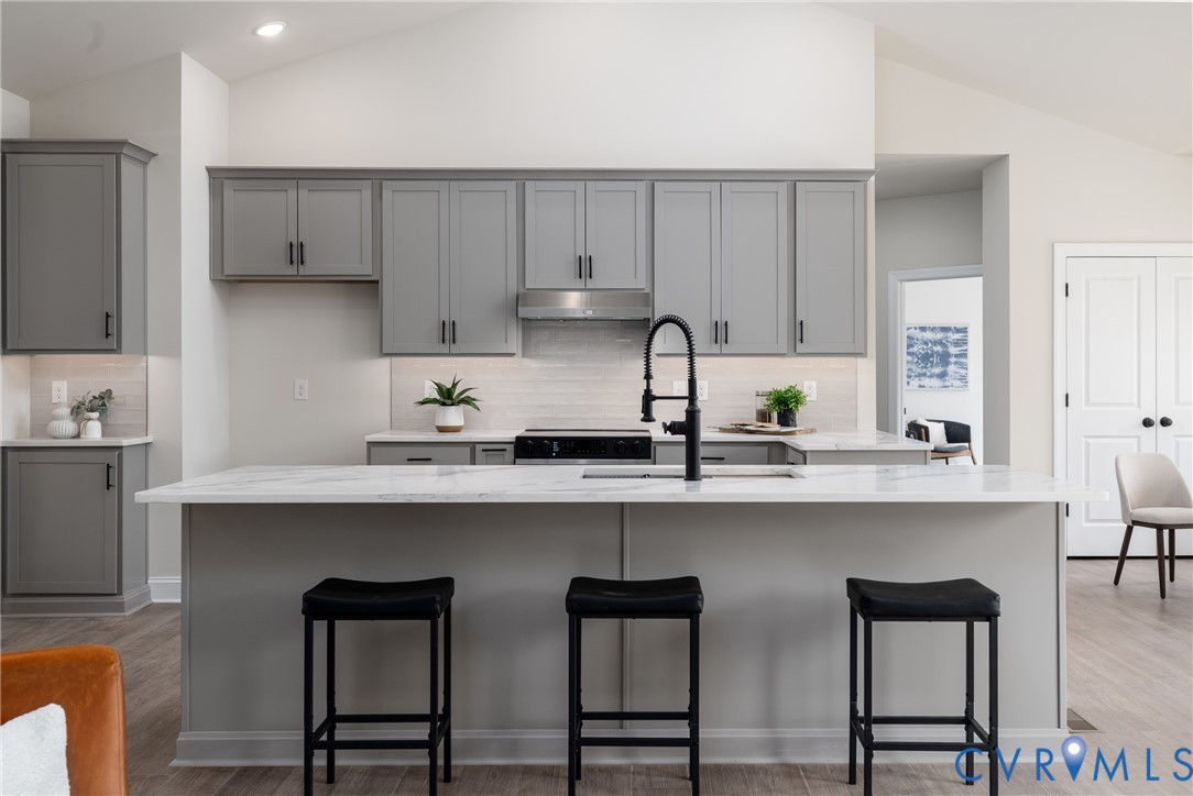 2301 Larkwood Road Henrico, VA 23294 - Photo 17 of 44 a kitchen with stainless steel appliances a sink and cabinets