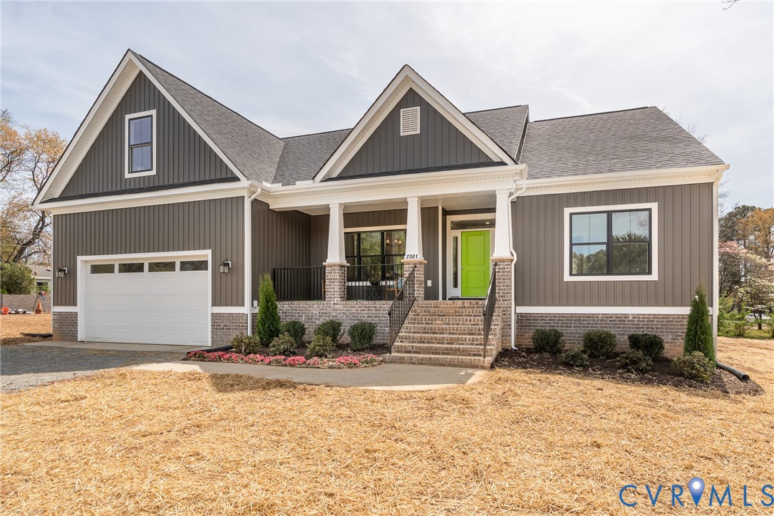 2301 Larkwood Road Henrico, VA 23294 - Photo 2 of 44 a front view of a house with a yard and seating space