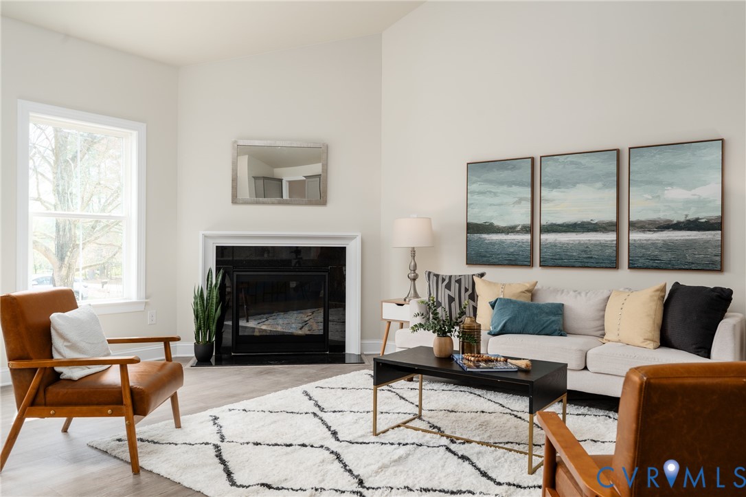 2301 Larkwood Road Henrico, VA 23294 - Photo 23 of 44 a living room with furniture and a fireplace