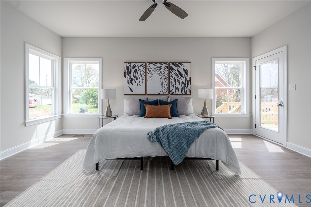 2301 Larkwood Road Henrico, VA 23294 - Photo 25 of 44 a bedroom with a bed and wooden floor