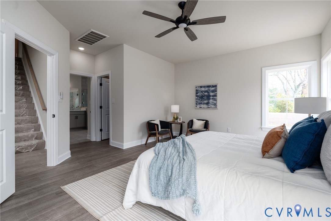 2301 Larkwood Road Henrico, VA 23294 - Photo 26 of 44 a bedroom with a bed and a large mirror