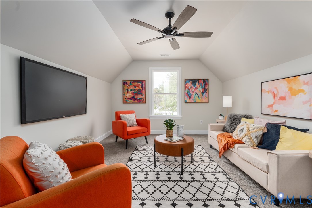 2301 Larkwood Road Henrico, VA 23294 - Photo 36 of 44 a living room with furniture and a flat screen tv