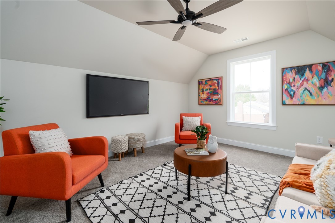 2301 Larkwood Road Henrico, VA 23294 - Photo 38 of 44 a living room with furniture and a flat screen tv