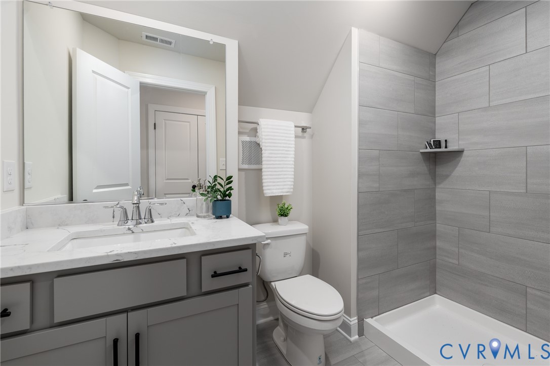 2301 Larkwood Road Henrico, VA 23294 - Photo 39 of 44 a bathroom with a sink a toilet and shower