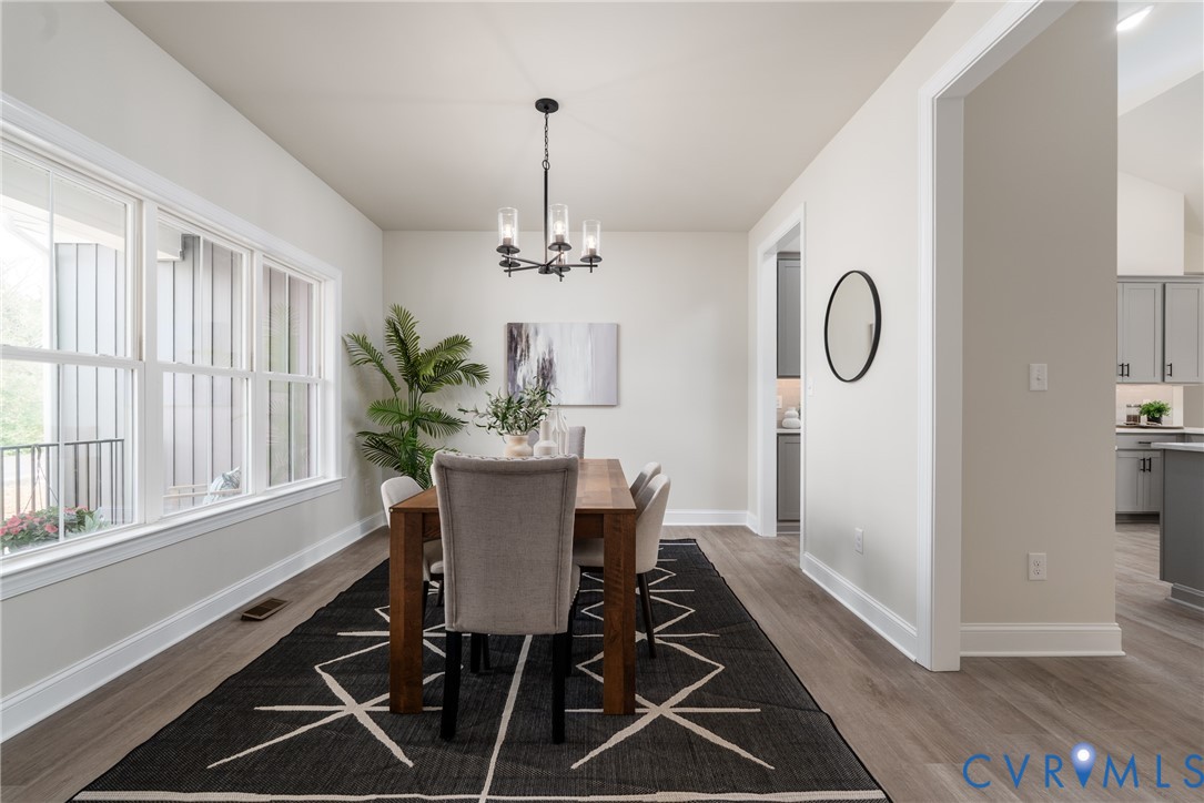 2301 Larkwood Road Henrico, VA 23294 - Photo 8 of 44 a view of a dining room with furniture window and wooden floor