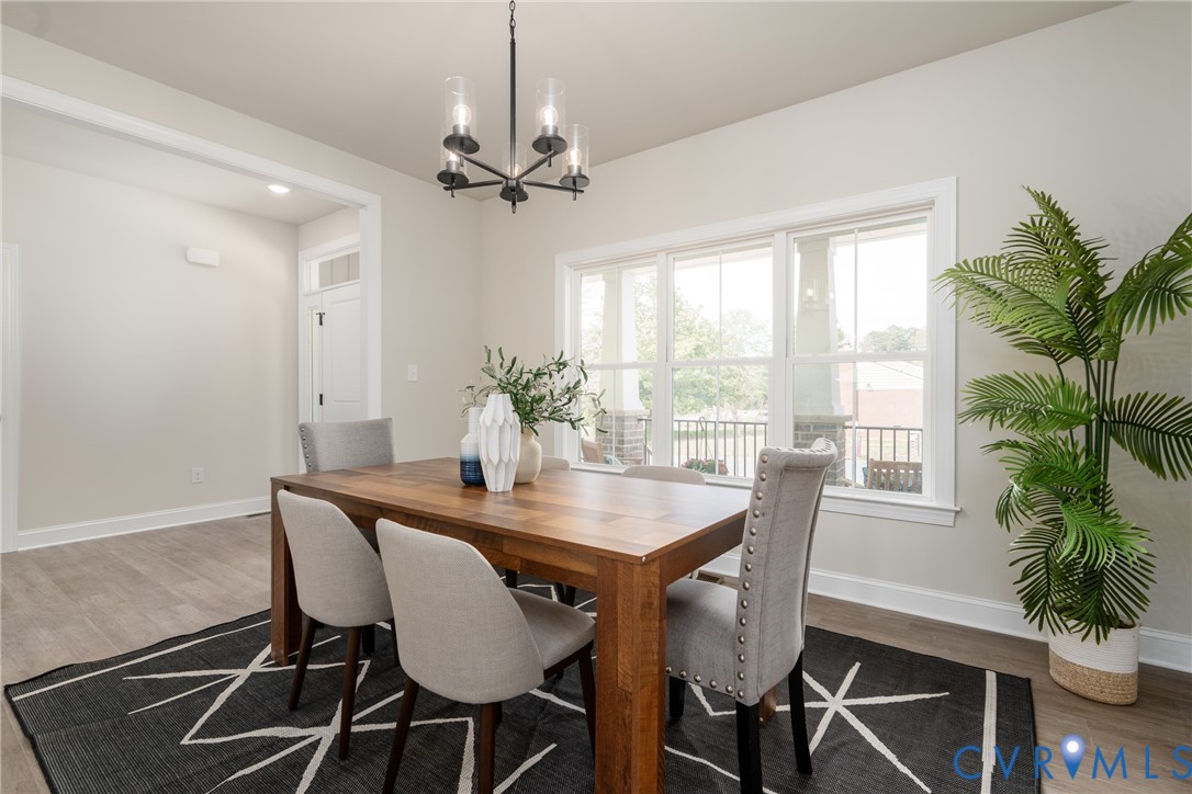 2301 Larkwood Road Henrico, VA 23294 - Photo 9 of 44 a view of a dining room with furniture window and wooden floor