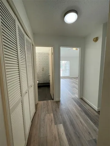 a kitchen with granite countertop a stove and a microwave