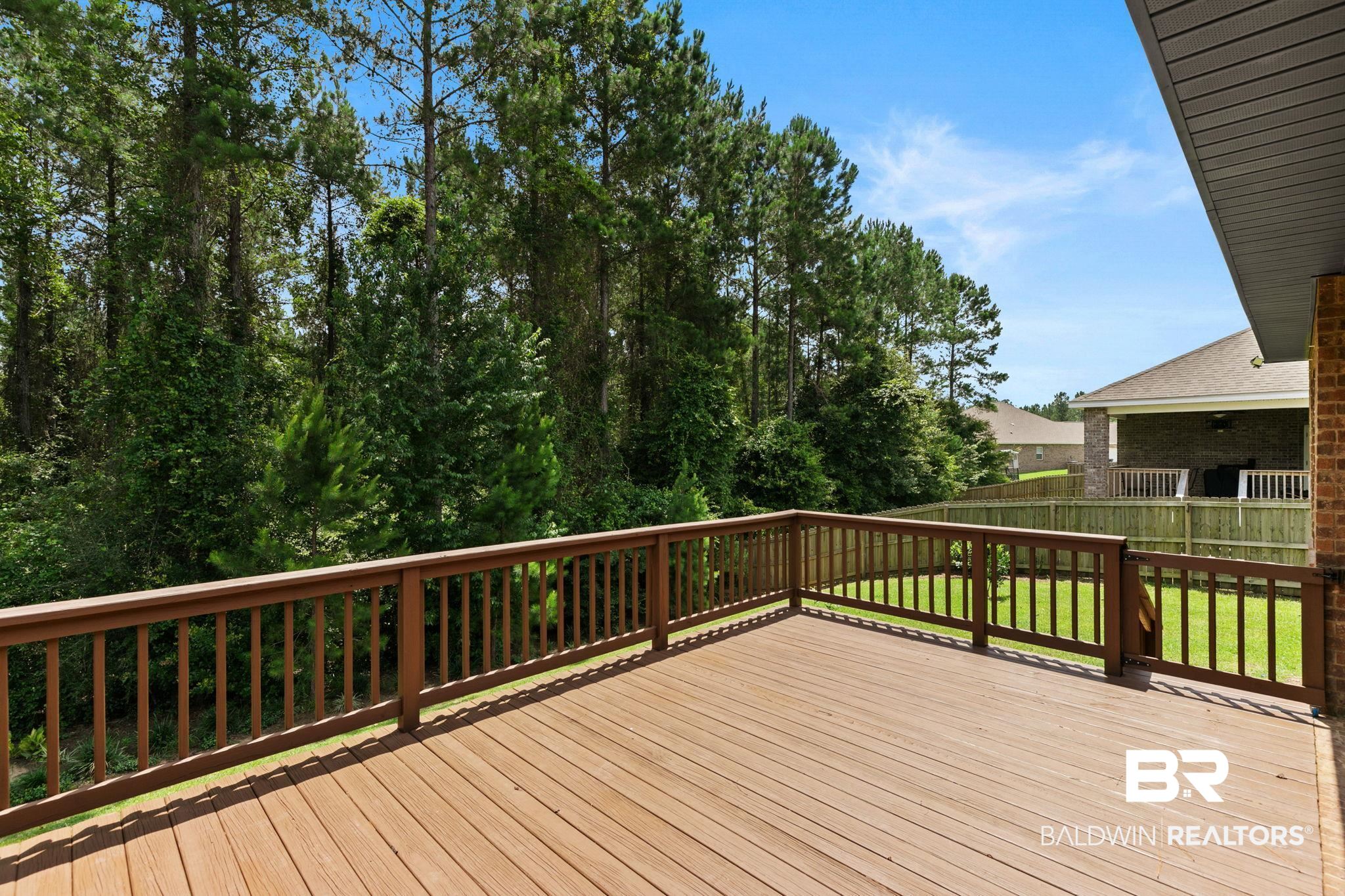 31350 Hoot Owl Road Daphne, AL 36527 - Photo 50 of 94 Expansive wood-finish deck with a built-in railing system