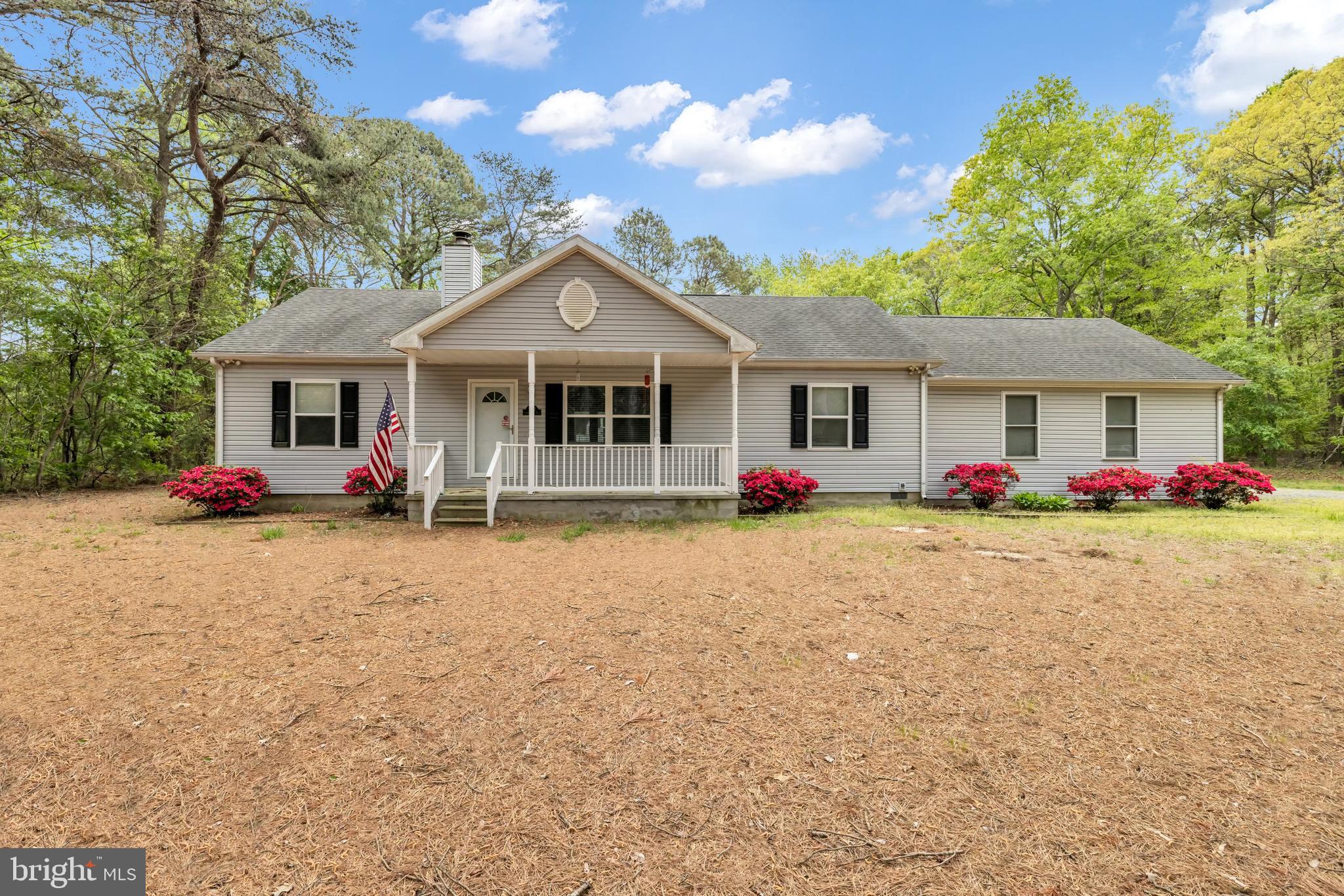 7392 Todds Wharf Road Preston, MD 21655 - Photo 1 of 63 a front view of a house with porch