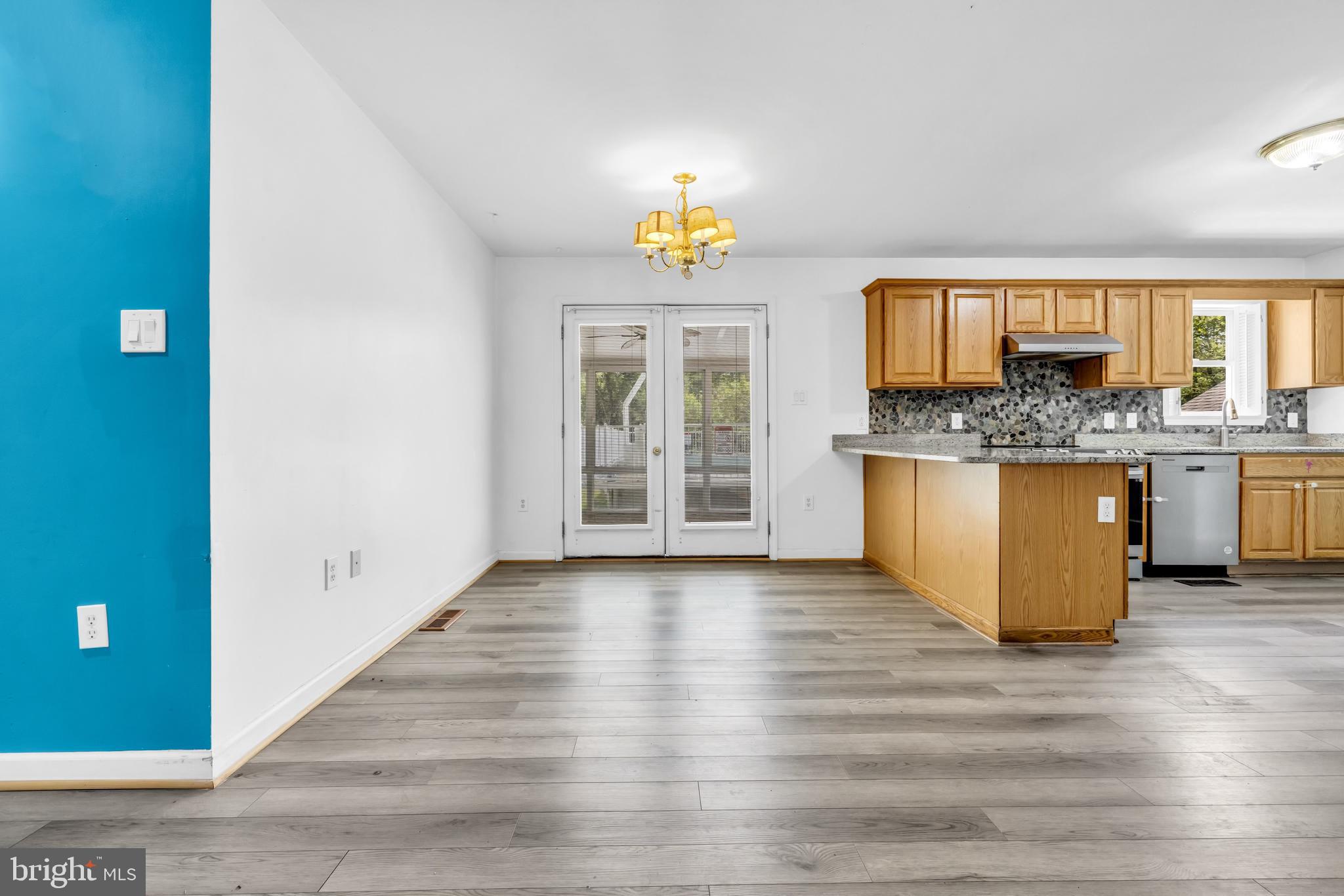 7392 Todds Wharf Road Preston, MD 21655 - Photo 16 of 63 a view of a kitchen with wooden floor and a sink