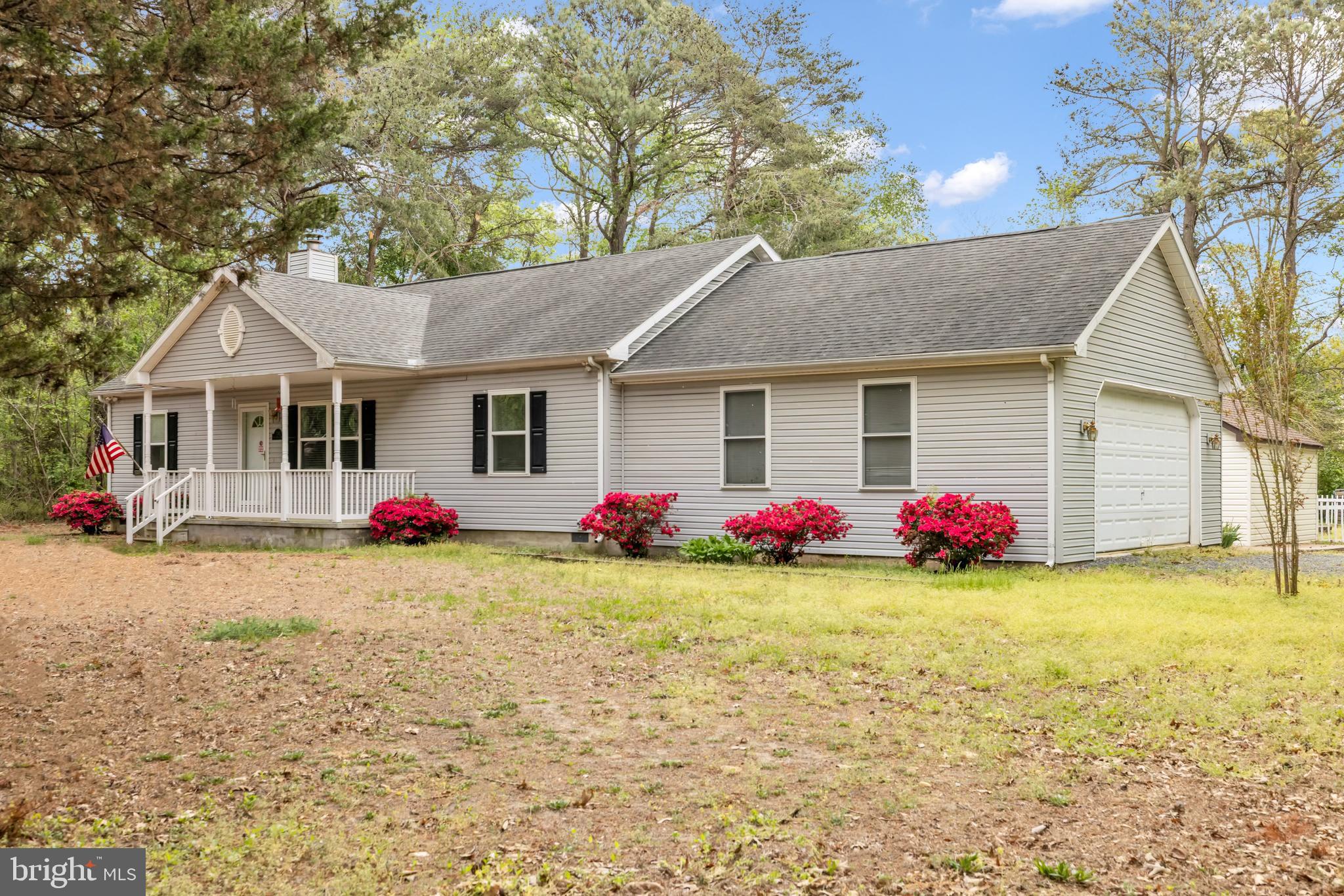 7392 Todds Wharf Road Preston, MD 21655 - Photo 2 of 63 a view of a house with a yard and garage