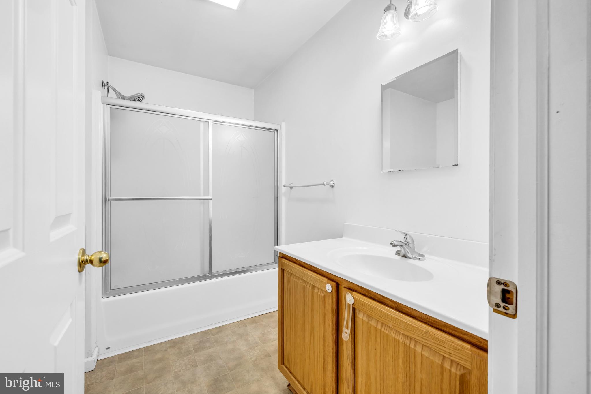 7392 Todds Wharf Road Preston, MD 21655 - Photo 36 of 63 a bathroom with a sink and a mirror