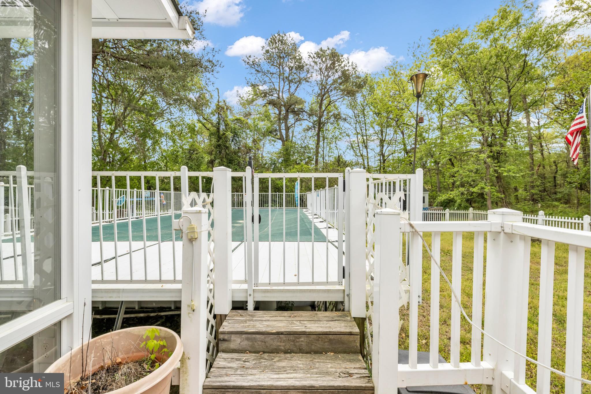 7392 Todds Wharf Road Preston, MD 21655 - Photo 49 of 63 a view of a balcony with wooden floor and fence