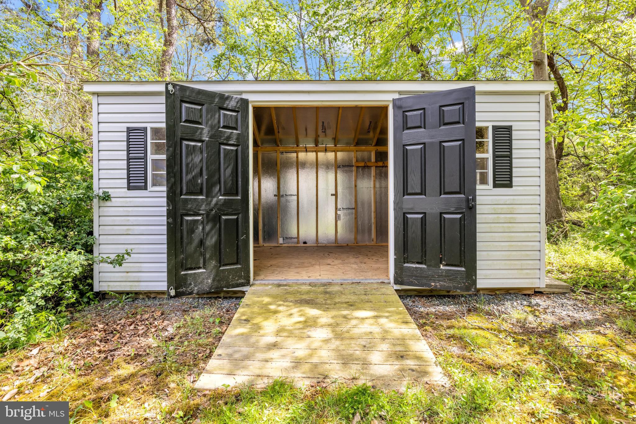 7392 Todds Wharf Road Preston, MD 21655 - Photo 55 of 63 a view of a house with a door and wooden fence