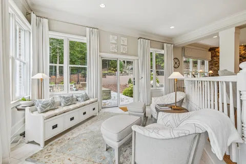 a bathroom with a granite countertop sink a large mirror and a