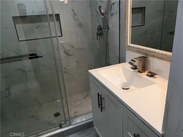 a bathroom with a sink and mirror