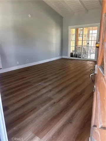 a kitchen with white cabinets and sink