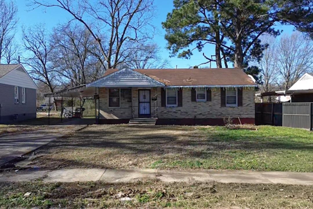 View of front of house featuring an attached carport