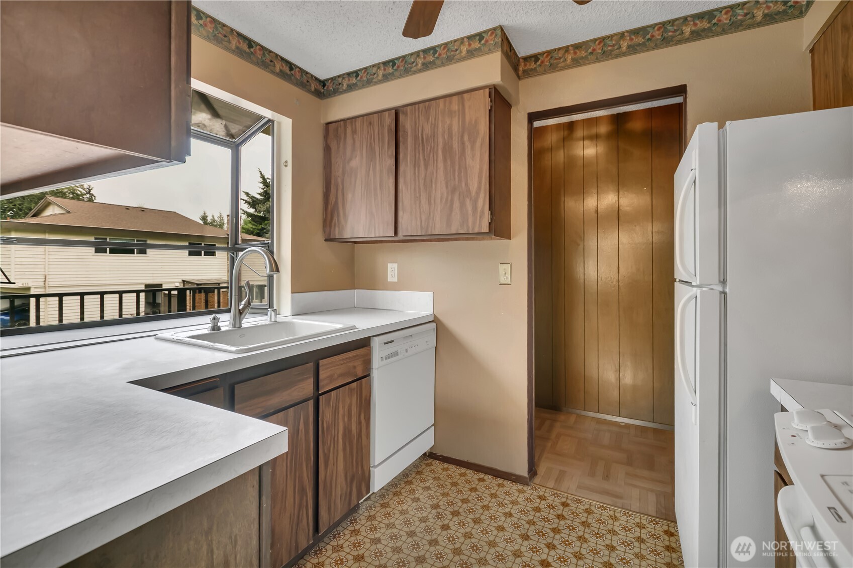 412 213th Place Southwest, Unit 21D Bothell, WA 98021 - Photo 15 of 28 a kitchen with stainless steel appliances granite countertop a refrigerator and a sink