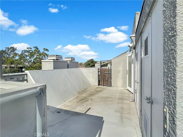 a balcony with view of nearby houses