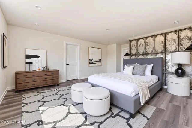 a bedroom with a bed and a couch