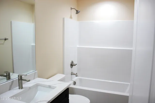 a bathroom with a bathtub a sink and a toilet