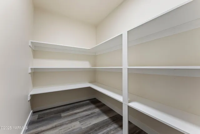 a storage room with wooden floor