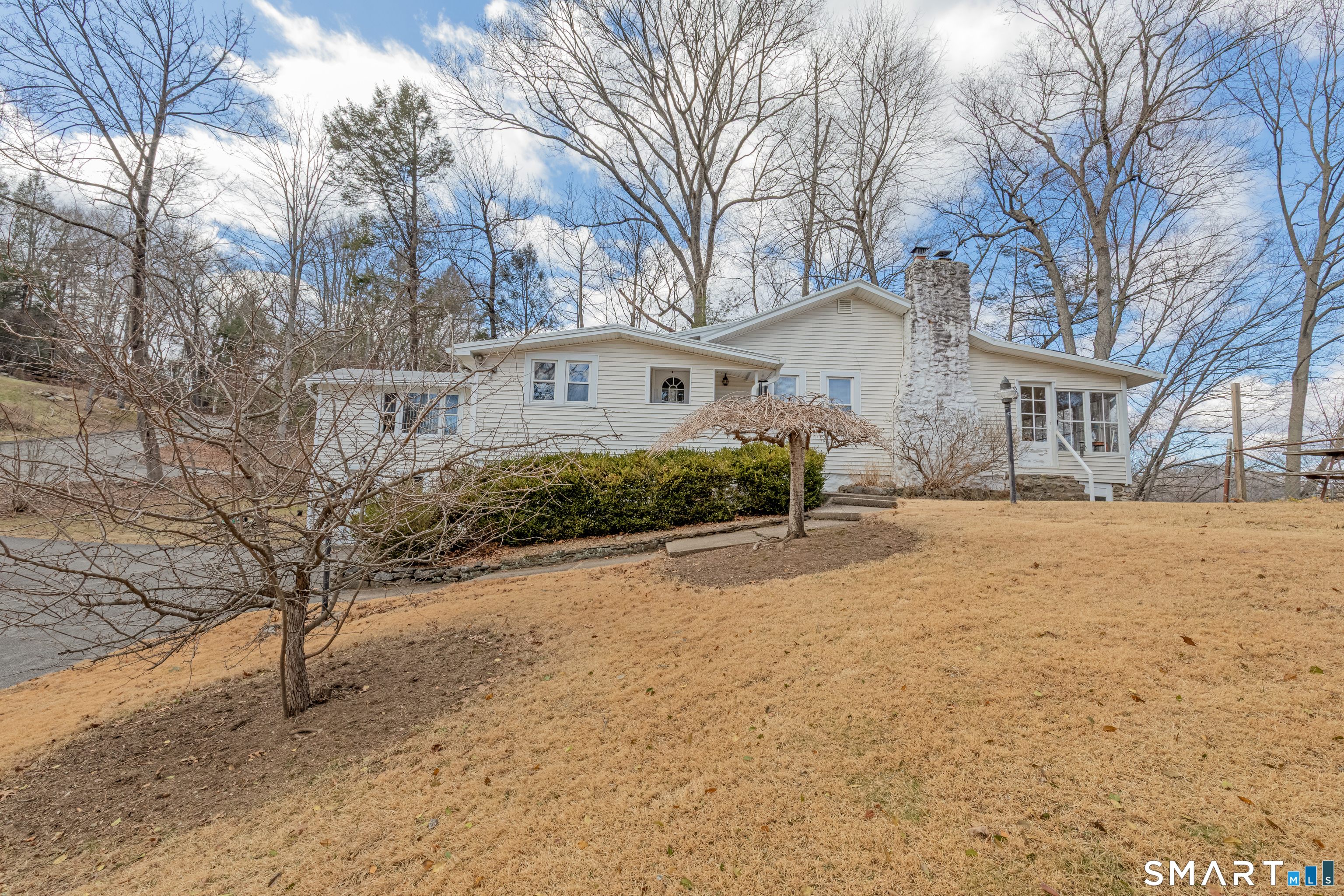 14 Laurel Trail Newtown, CT 06482 - Photo 1 of 39 a front view of a house with a yard and garage