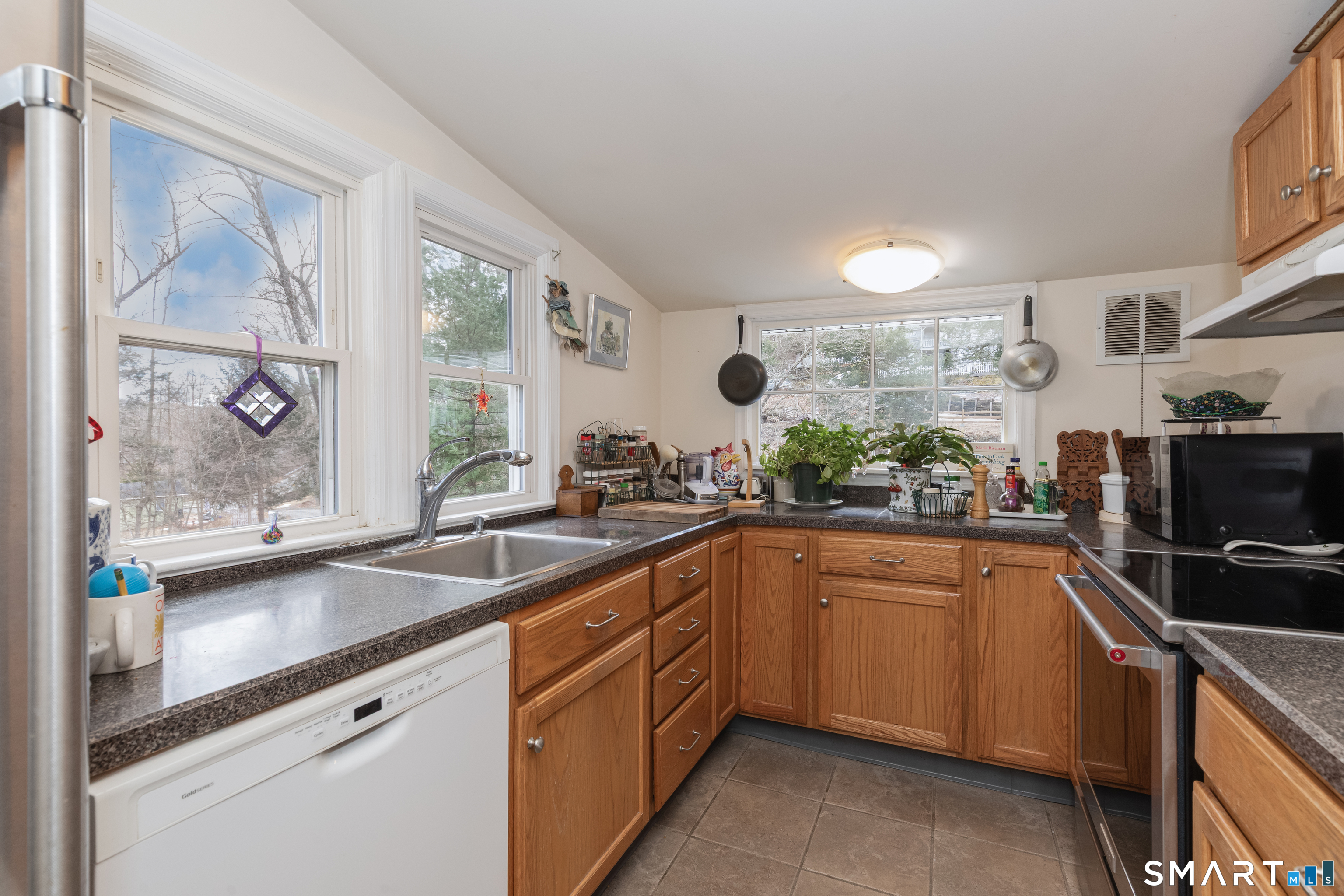 14 Laurel Trail Newtown, CT 06482 - Photo 12 of 39 a kitchen with a sink and cabinets