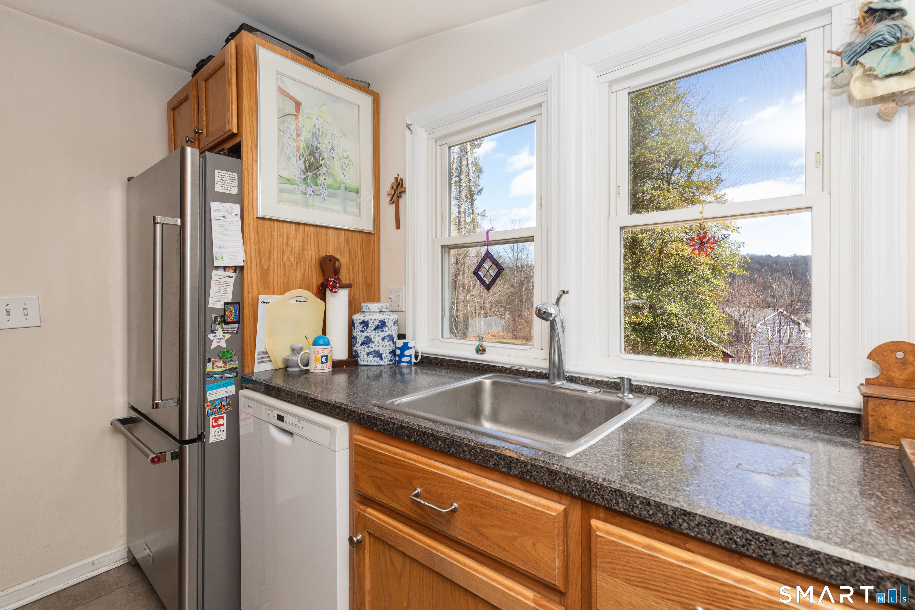 14 Laurel Trail Newtown, CT 06482 - Photo 13 of 39 a view of a sink a mirror and a window