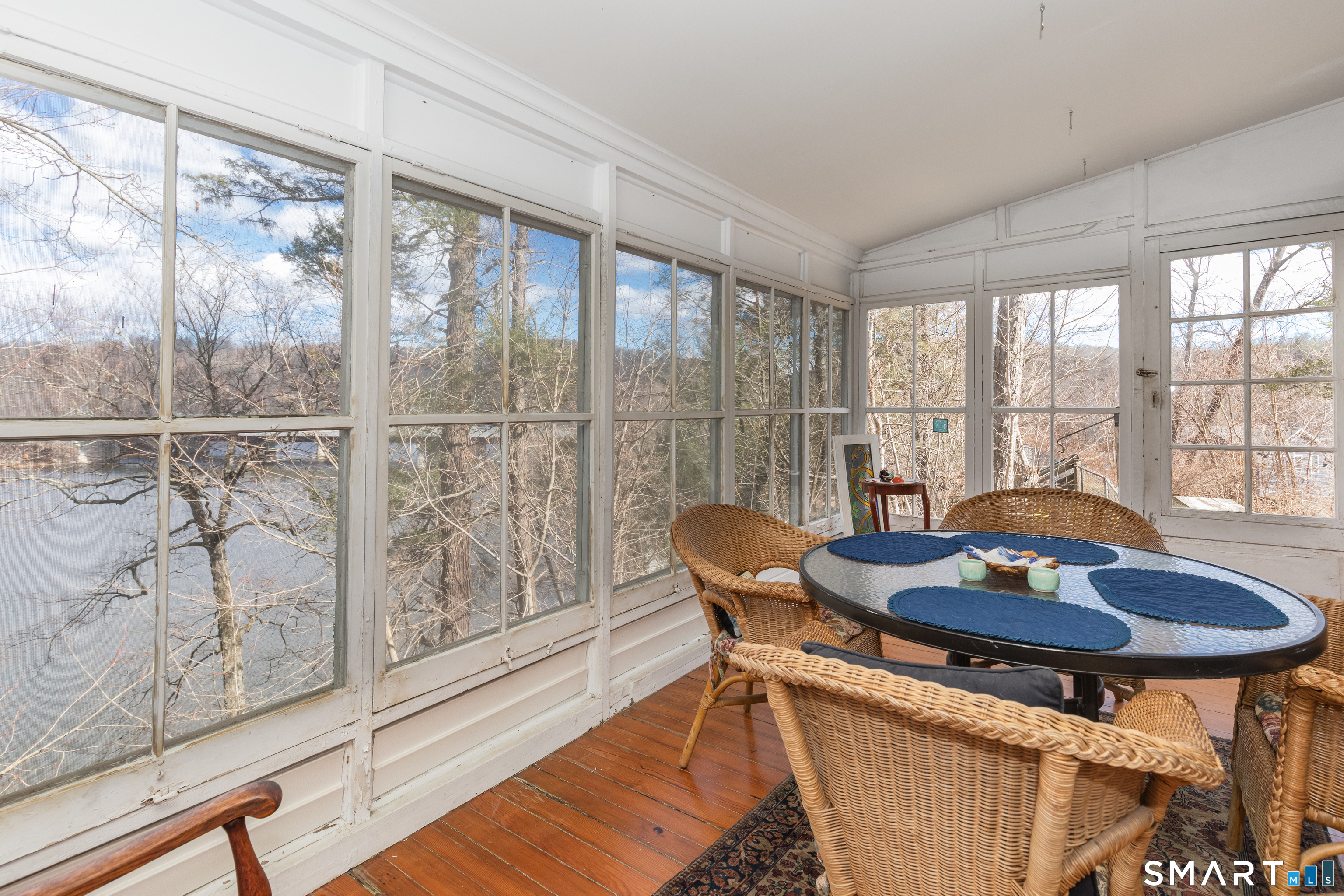14 Laurel Trail Newtown, CT 06482 - Photo 17 of 39 a view of a dining room with furniture wooden floor and a potted plant