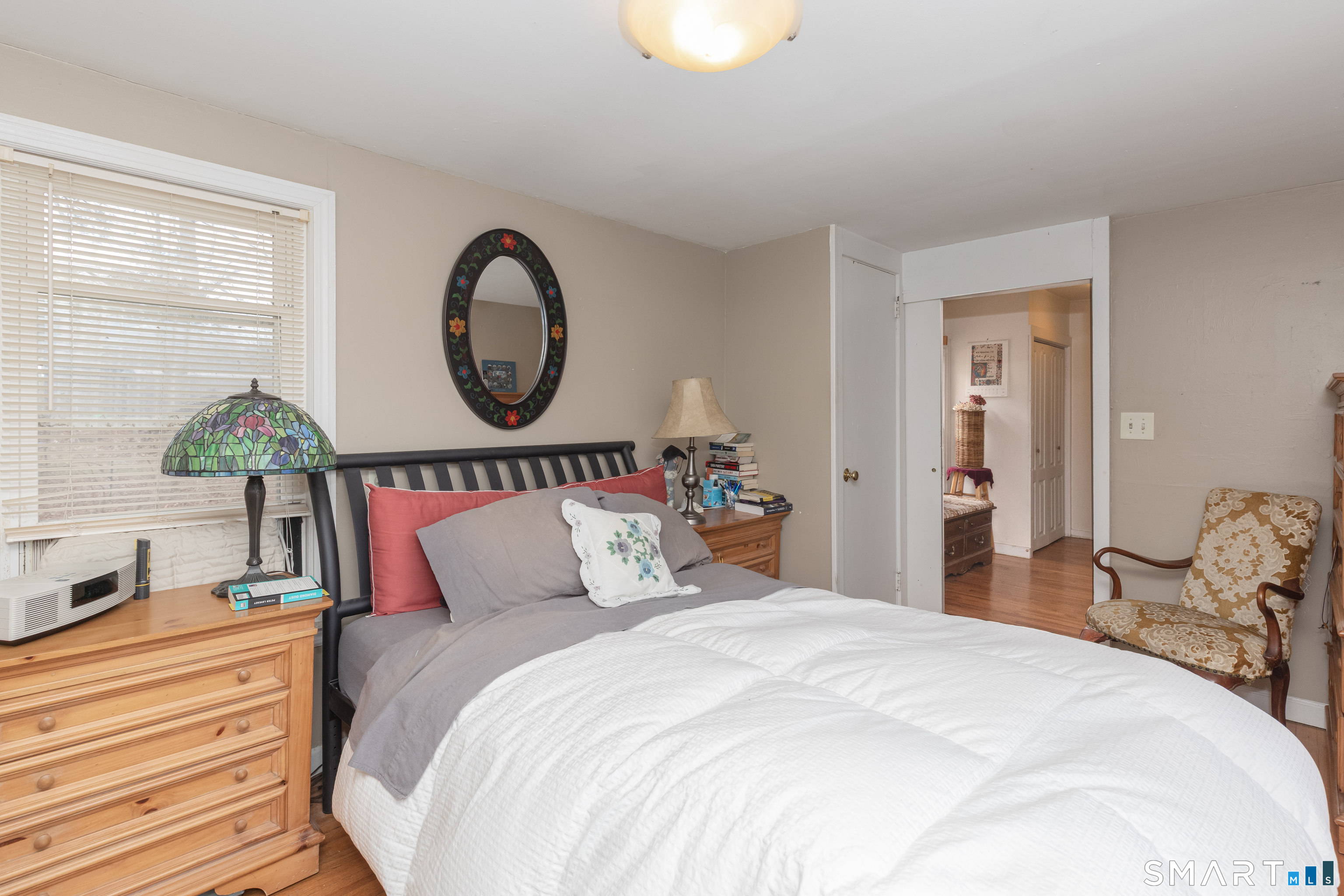 14 Laurel Trail Newtown, CT 06482 - Photo 18 of 39 a bedroom with bed and a chandelier