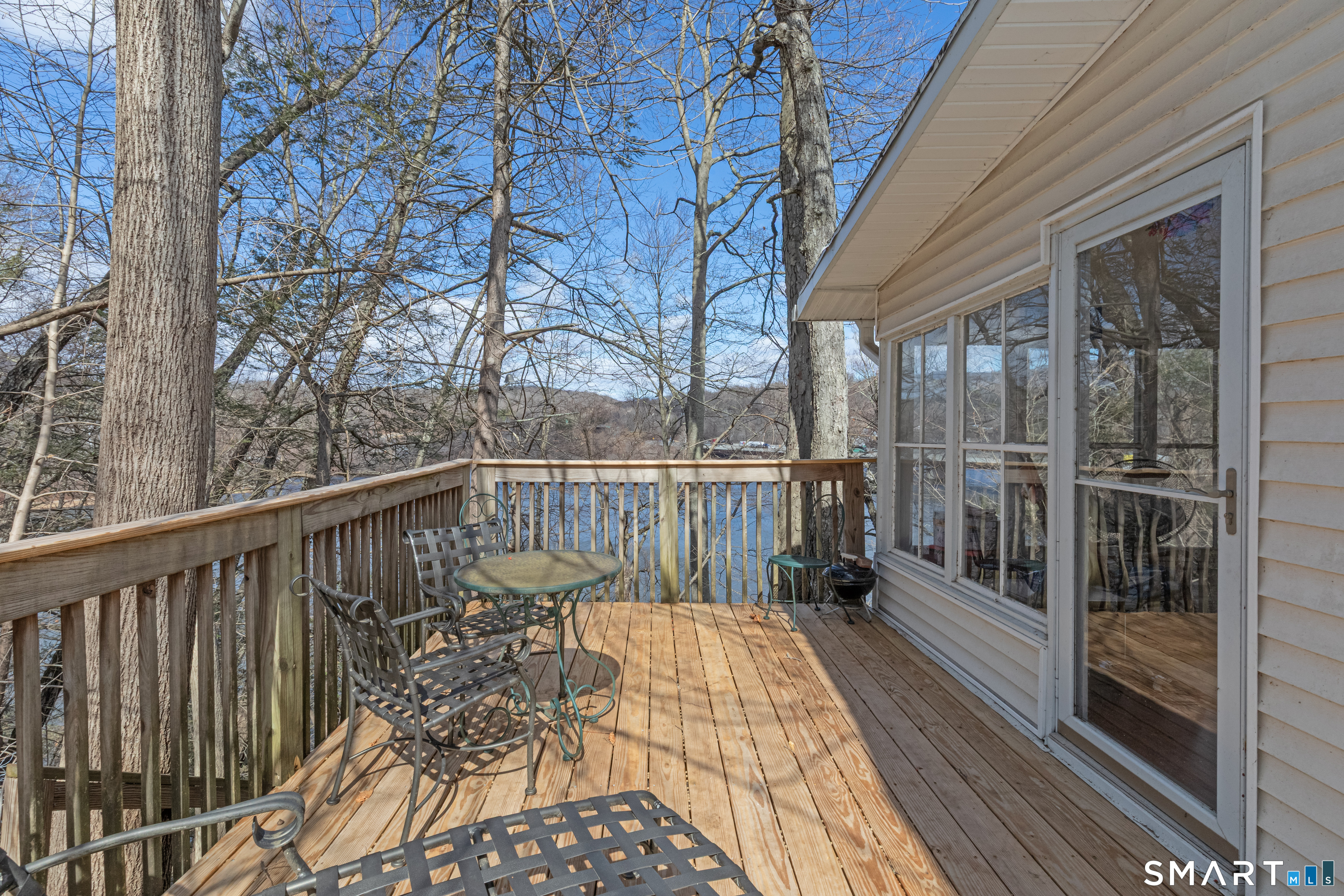 14 Laurel Trail Newtown, CT 06482 - Photo 2 of 39 a view of balcony with wooden floor and fence