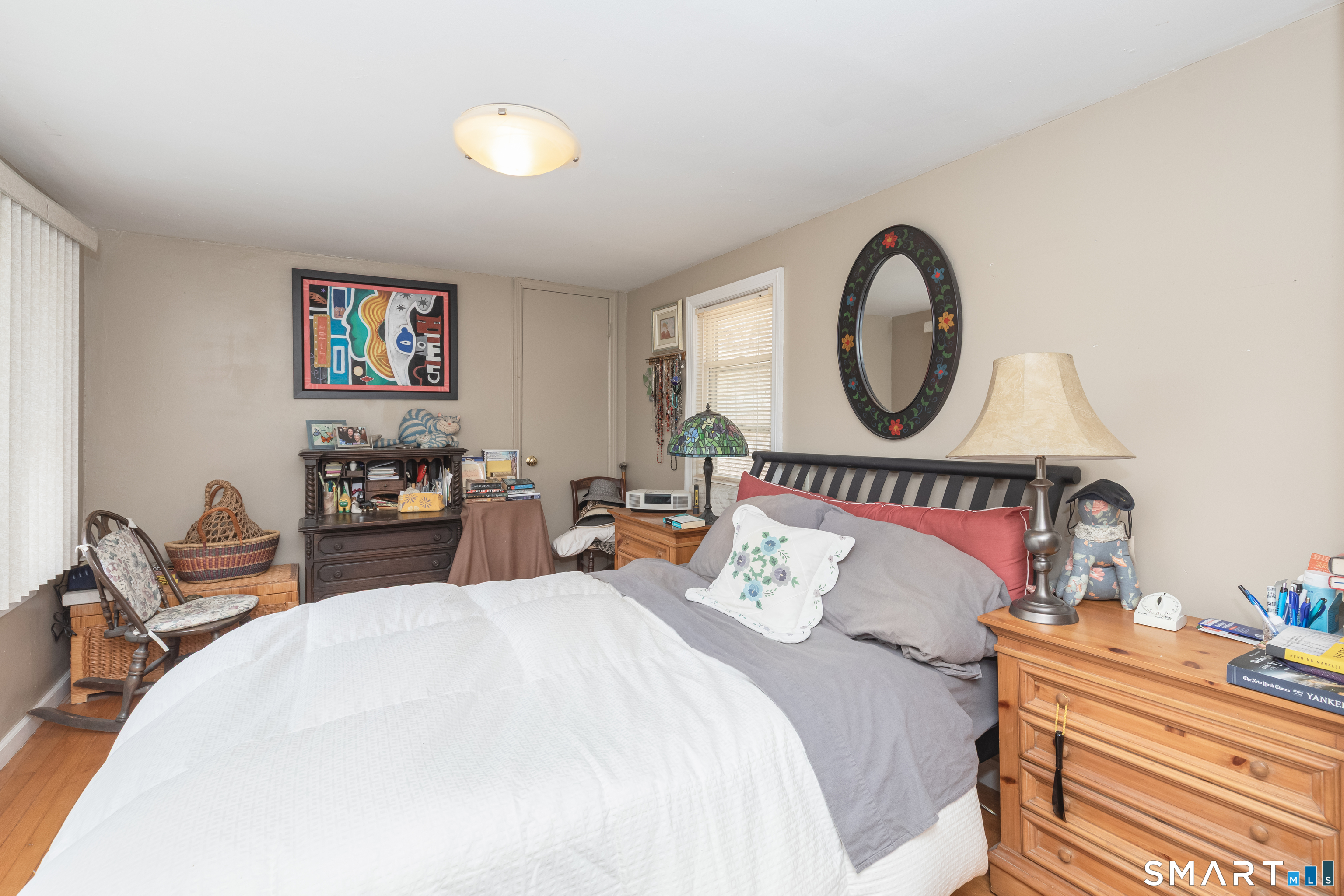 14 Laurel Trail Newtown, CT 06482 - Photo 21 of 39 a bedroom with bed and a chandelier