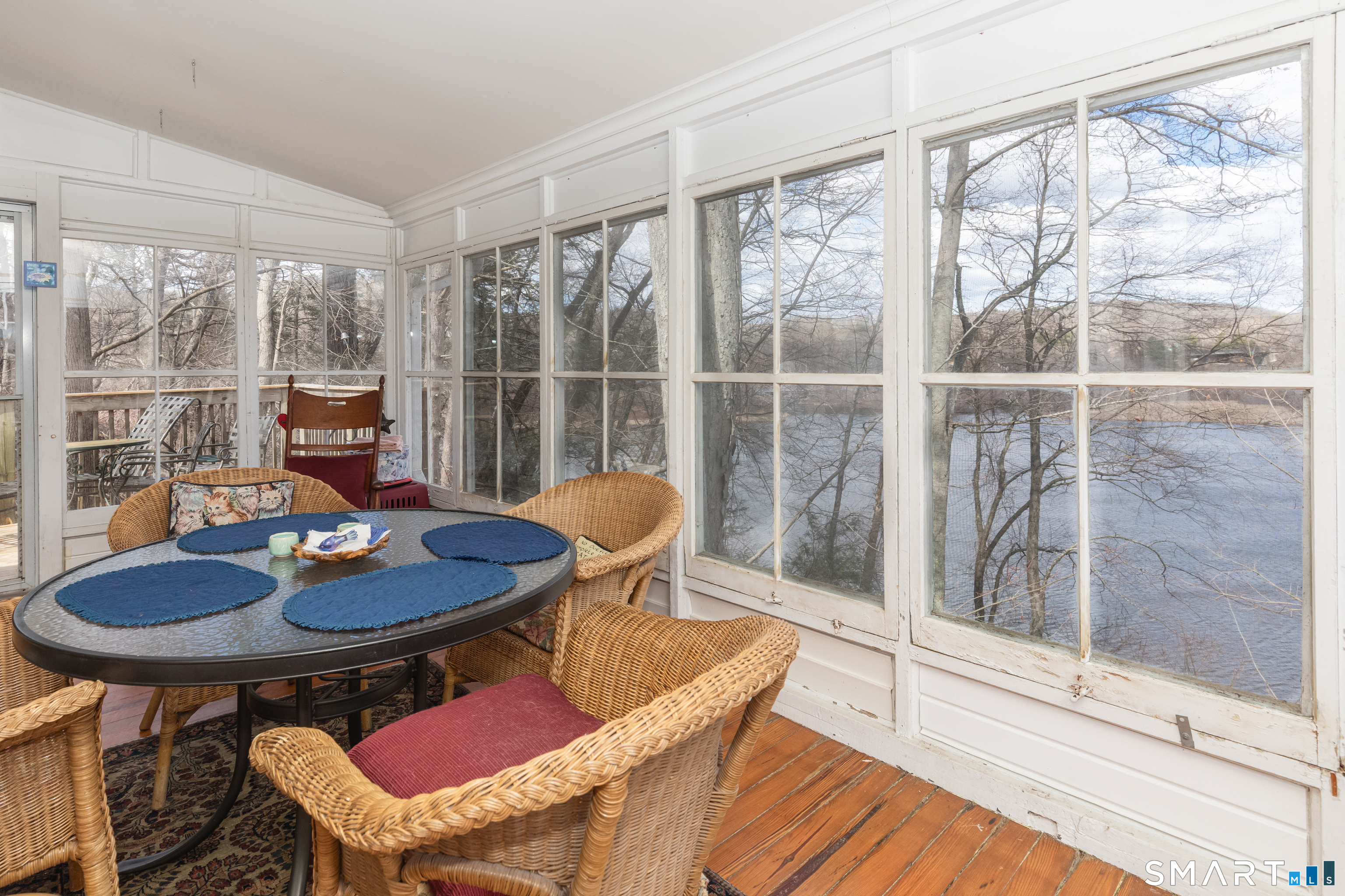 14 Laurel Trail Newtown, CT 06482 - Photo 3 of 39 a view of a dining room with furniture wooden floor and a window