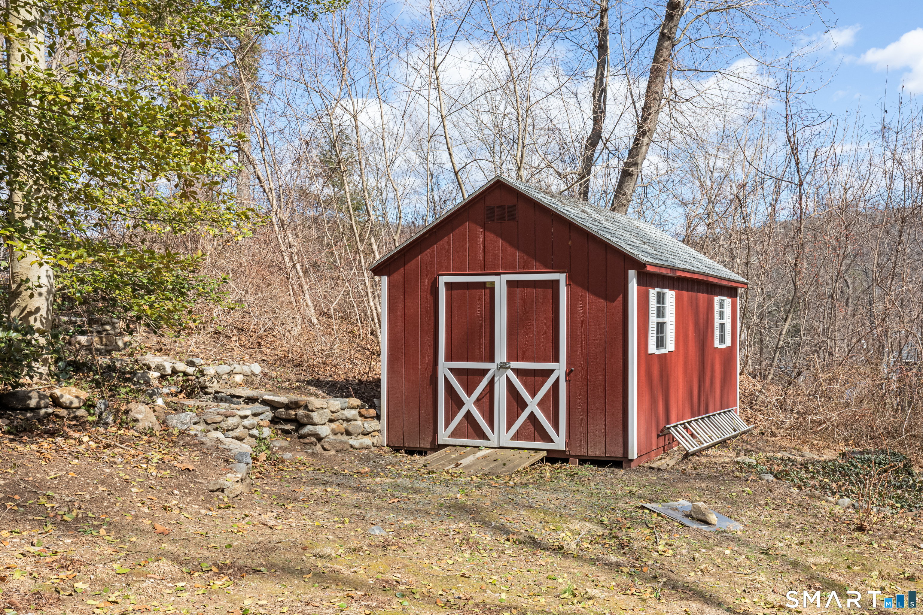 14 Laurel Trail Newtown, CT 06482 - Photo 33 of 39 a front view of a house with parking area
