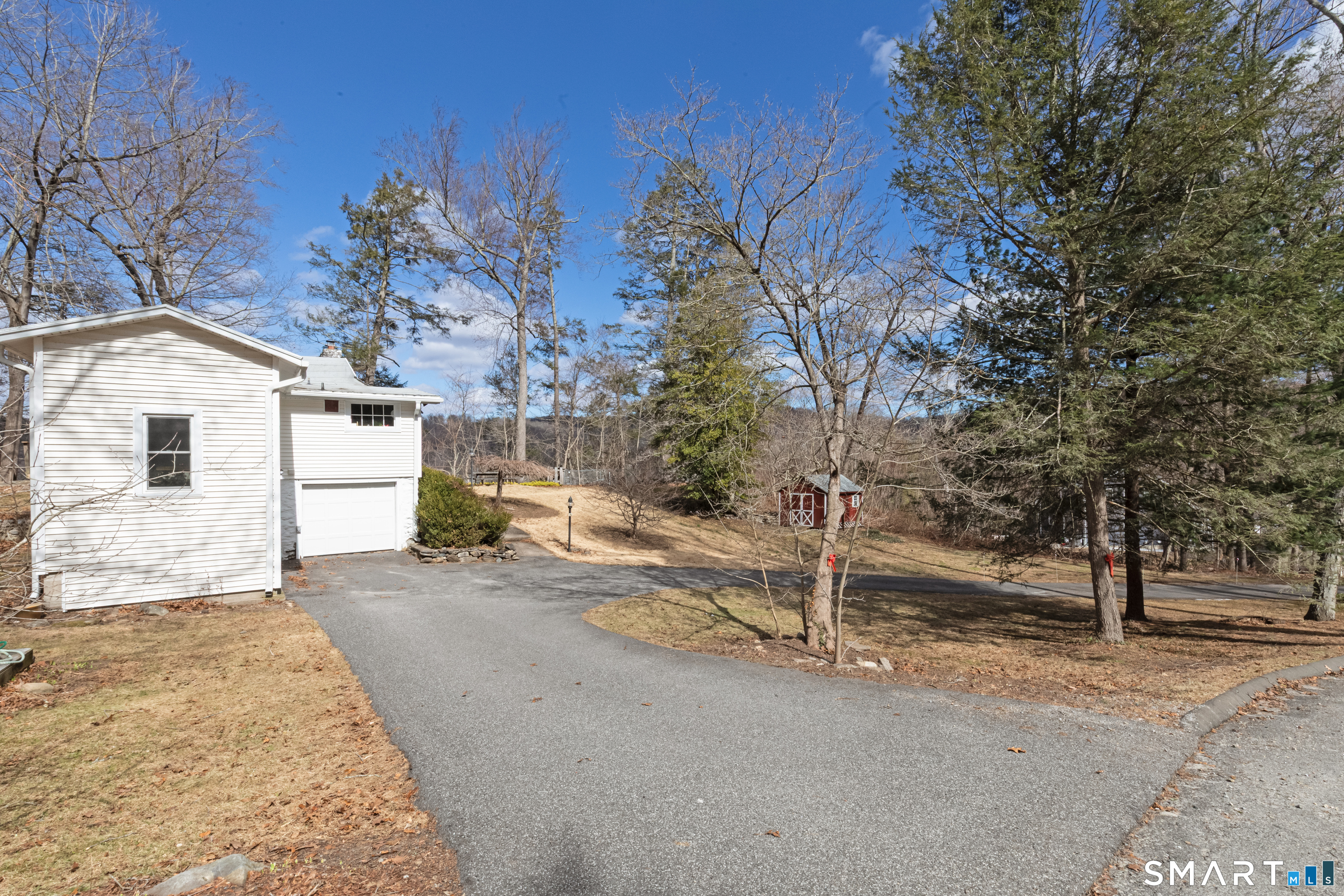 14 Laurel Trail Newtown, CT 06482 - Photo 37 of 39 a view of a house with a yard and garage