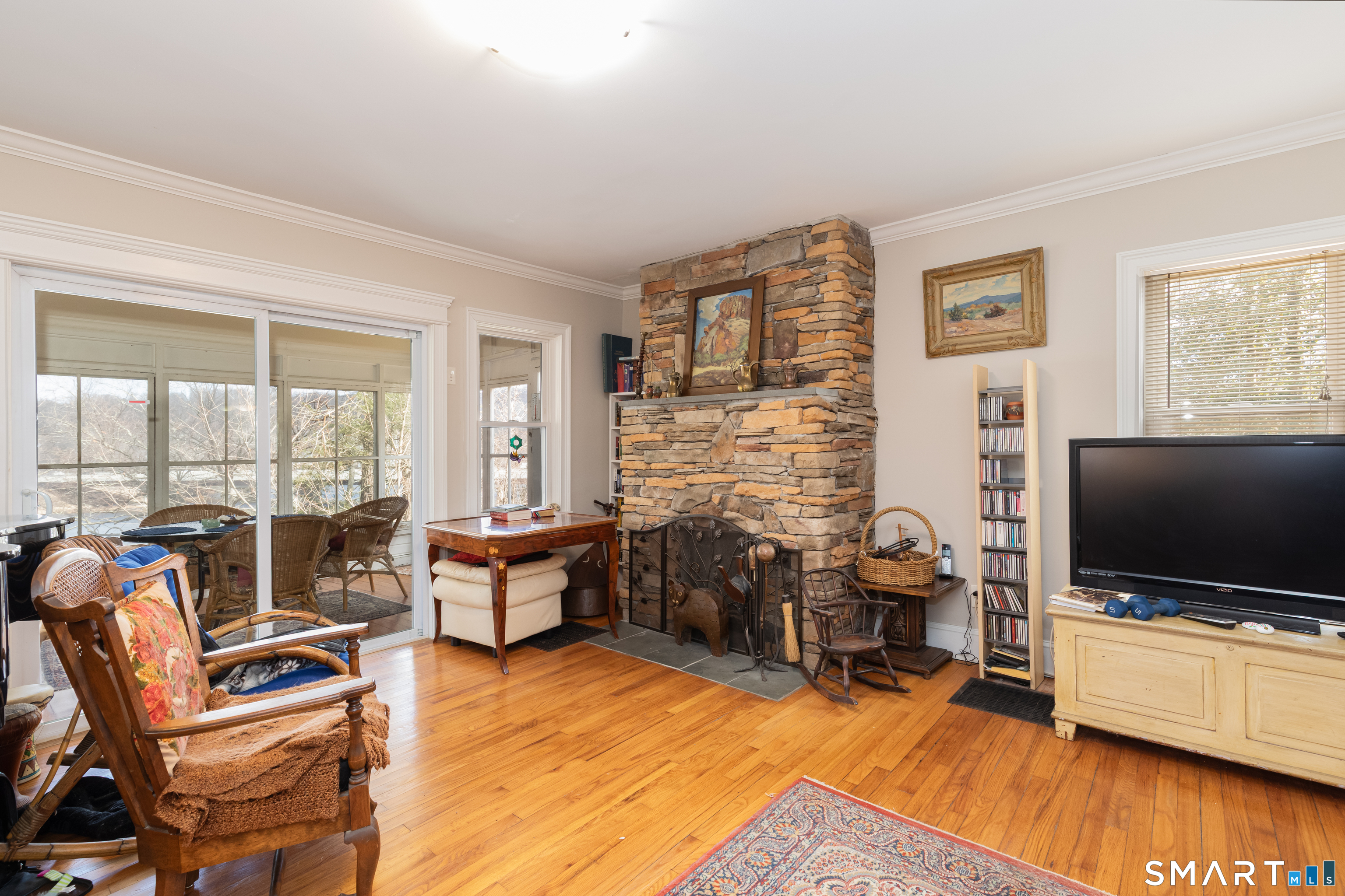 14 Laurel Trail Newtown, CT 06482 - Photo 7 of 39 a living room with furniture and a flat screen tv