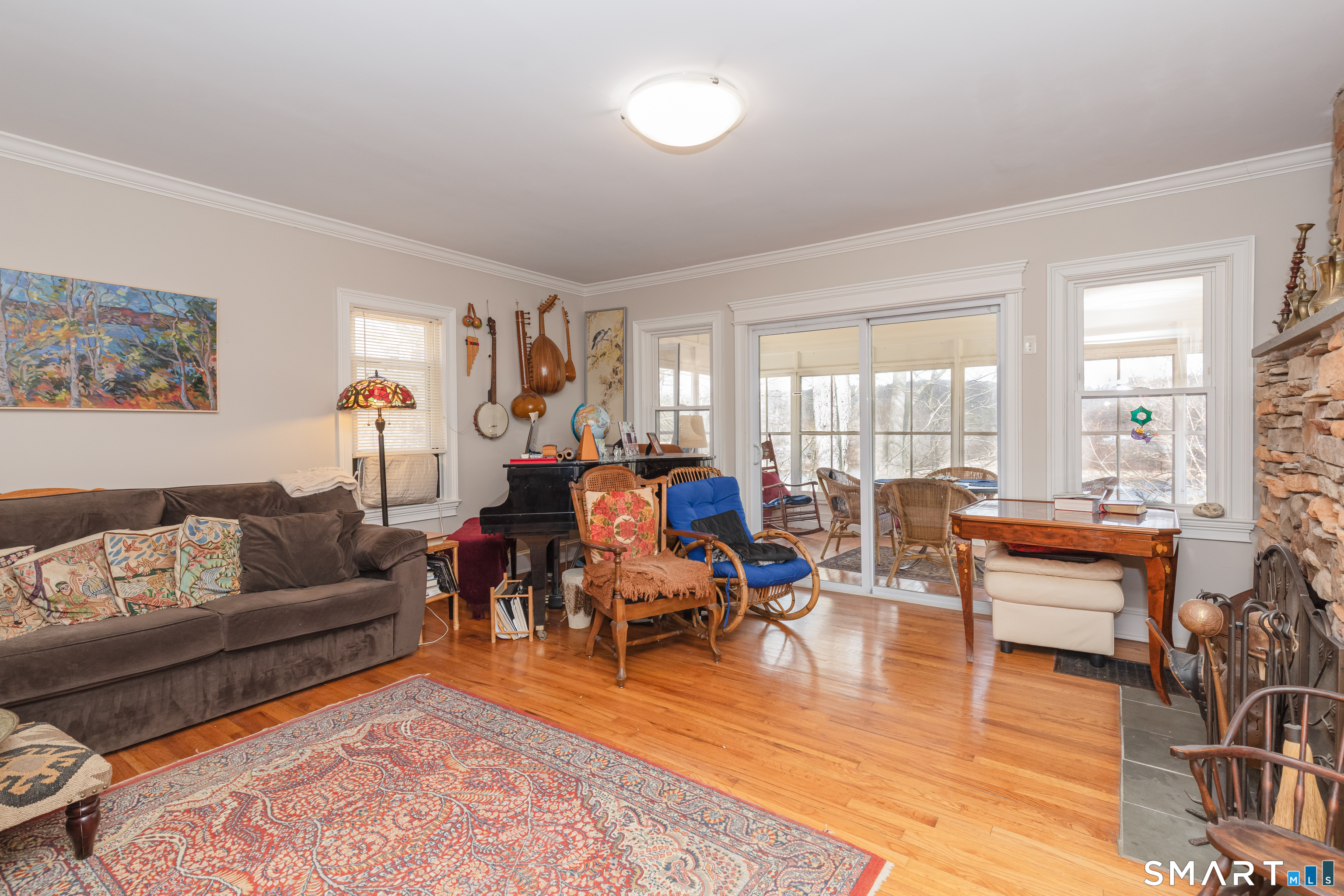 14 Laurel Trail Newtown, CT 06482 - Photo 9 of 39 a living room with furniture and a large window