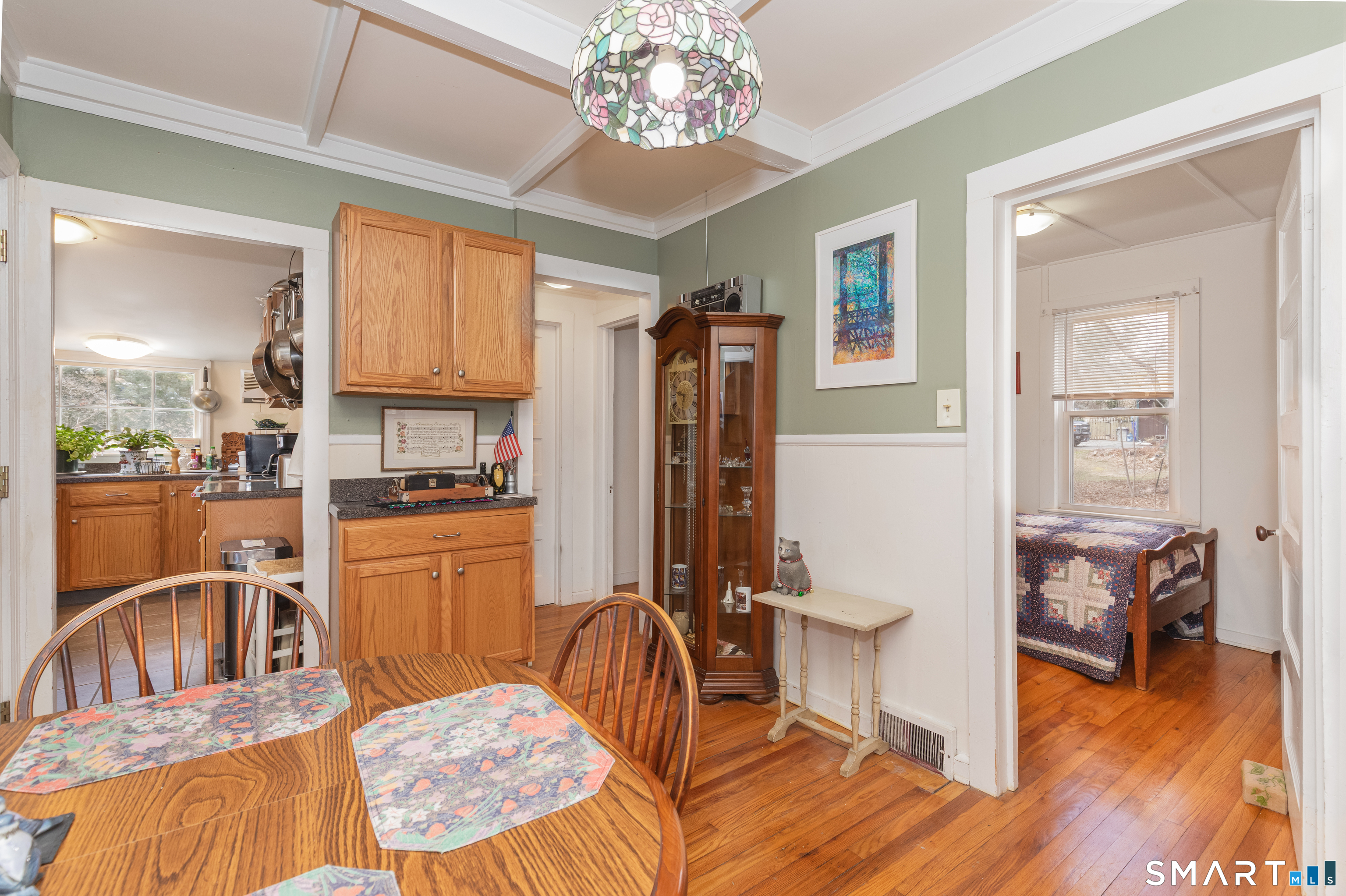 14 Laurel Trail Newtown, CT 06482 - Photo 10 of 39 a kitchen with stainless steel appliances granite countertop a refrigerator a sink dishwasher a dining table and chairs with wooden floor