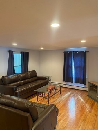 20 Walnut Road Boston, MA 02132 - Photo 16 of 34 a living room with furniture and wooden floor