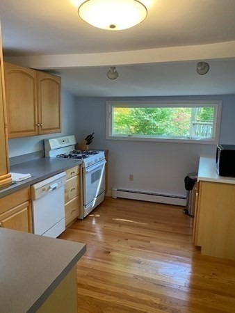20 Walnut Road Boston, MA 02132 - Photo 17 of 34 a kitchen with stainless steel appliances granite countertop a sink and a stove