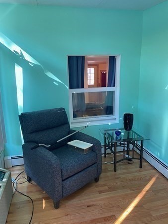 20 Walnut Road Boston, MA 02132 - Photo 20 of 34 a living room with furniture and a wooden floor