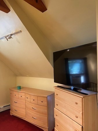 20 Walnut Road Boston, MA 02132 - Photo 27 of 34 a kitchen with granite countertop white cabinets and stainless steel appliances