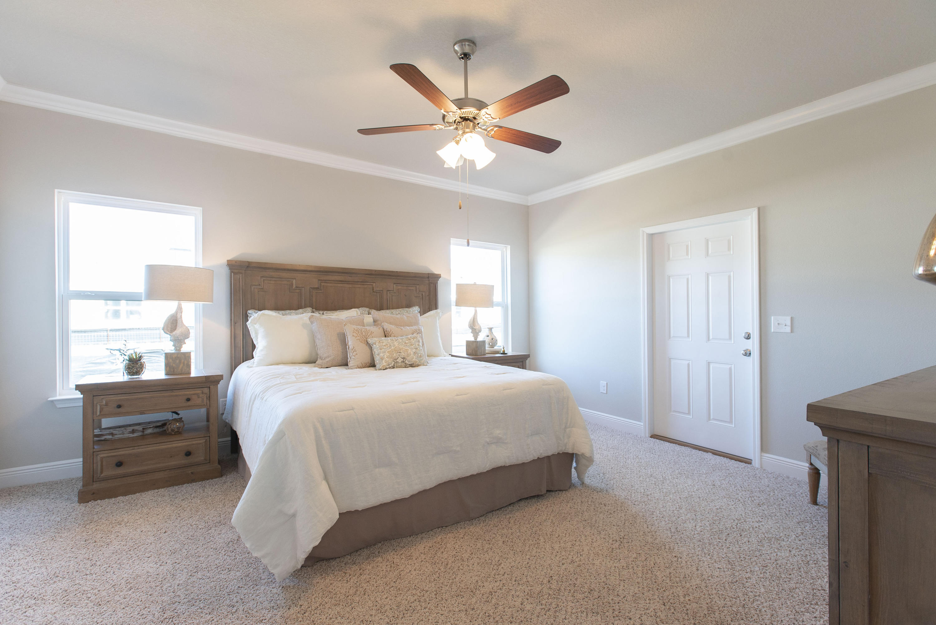 238 Stonegate Circle, Unit 33 Santa Rosa Beach, FL 32459 - Photo 14 of 26 a bedroom with a large bed and a ceiling fan