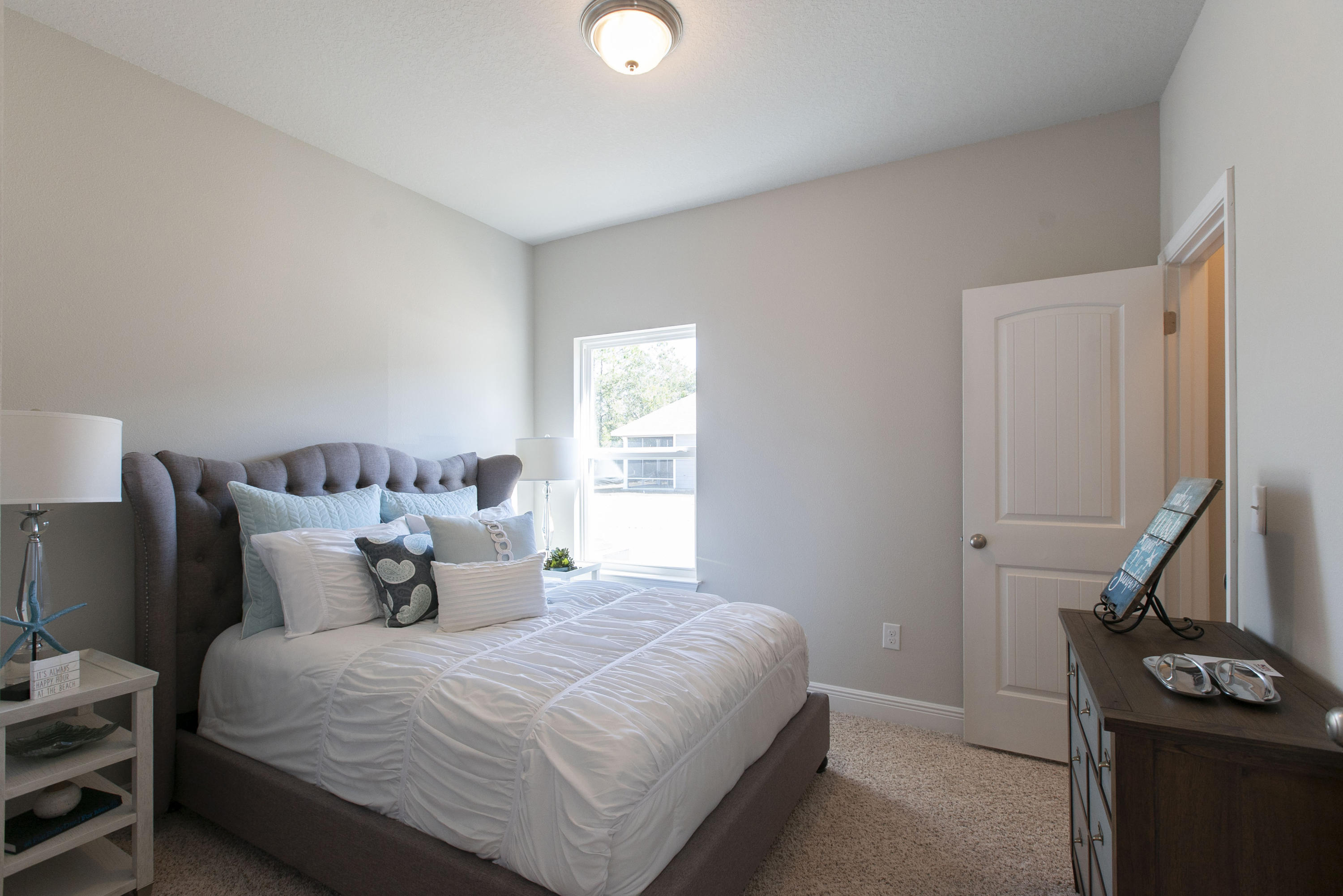 238 Stonegate Circle, Unit 33 Santa Rosa Beach, FL 32459 - Photo 3 of 26 a bedroom with a bed and a window
