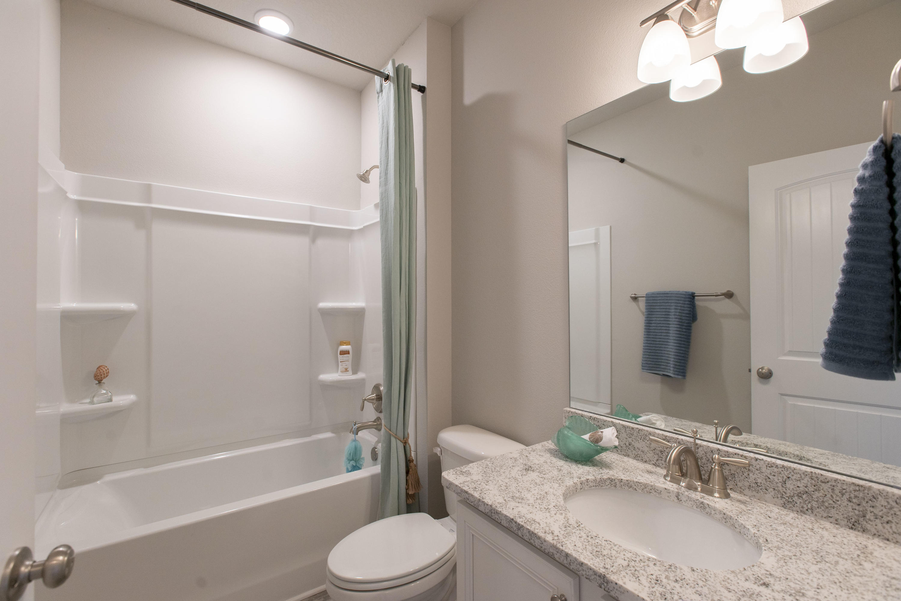 238 Stonegate Circle, Unit 33 Santa Rosa Beach, FL 32459 - Photo 7 of 26 a bathroom with a granite countertop sink a toilet and shower
