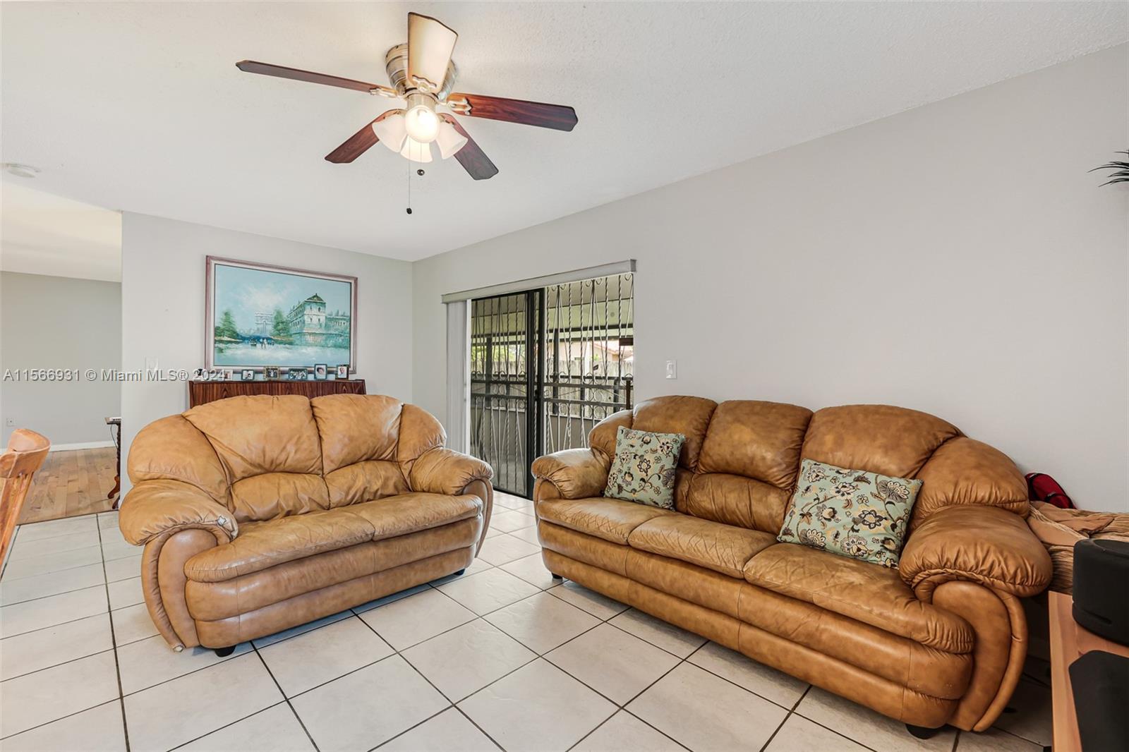 13202 Southwest 12th Lane Miami, FL 33184 - Photo 12 of 47 a living room with furniture and a large window